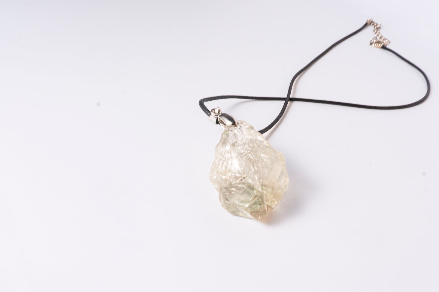 Clear Quartz Raw Stone Pendant with Green Glow